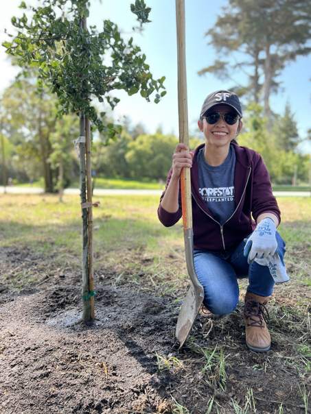 GroupGreeting COO Stephanie Terada planting a tree